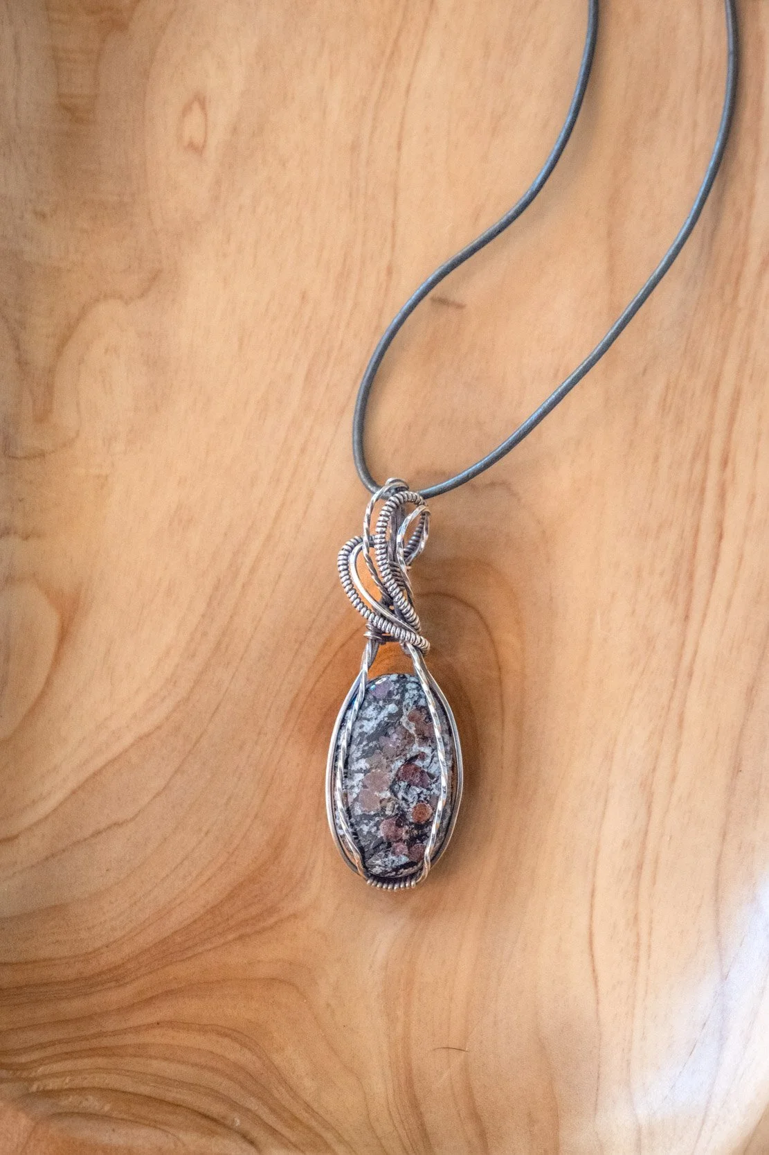 Almandine Garnet wrapped in sterling silver & oxidized