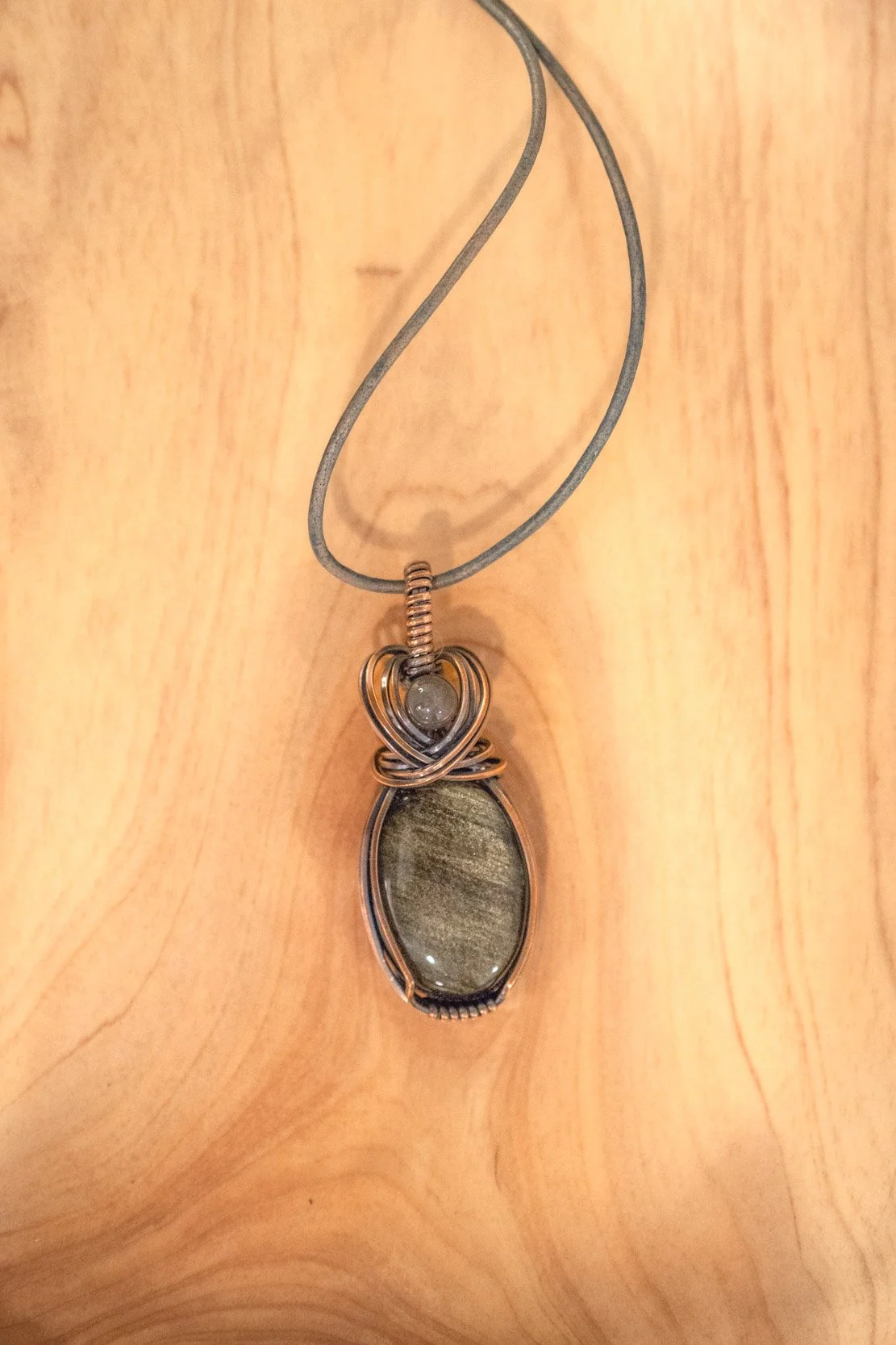 Golden Obsidian wrapped in raw copper & oxidized