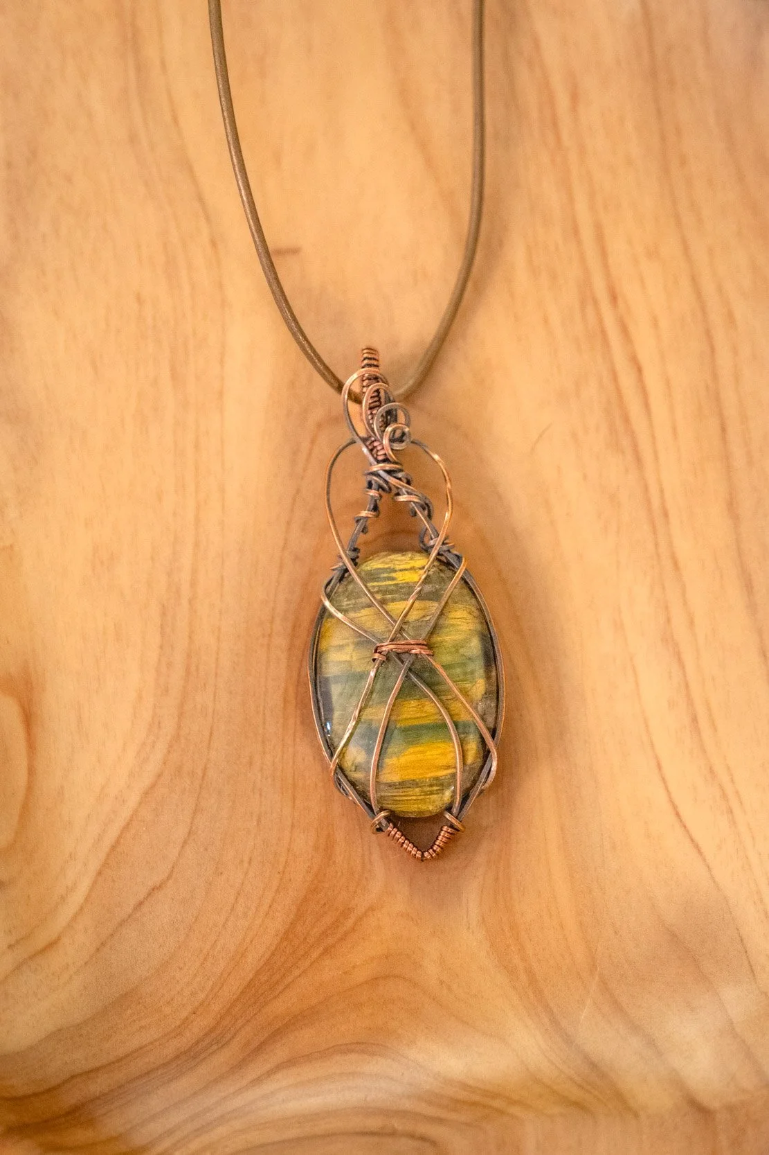 Falcon's Eye wrapped in raw copper & oxidized