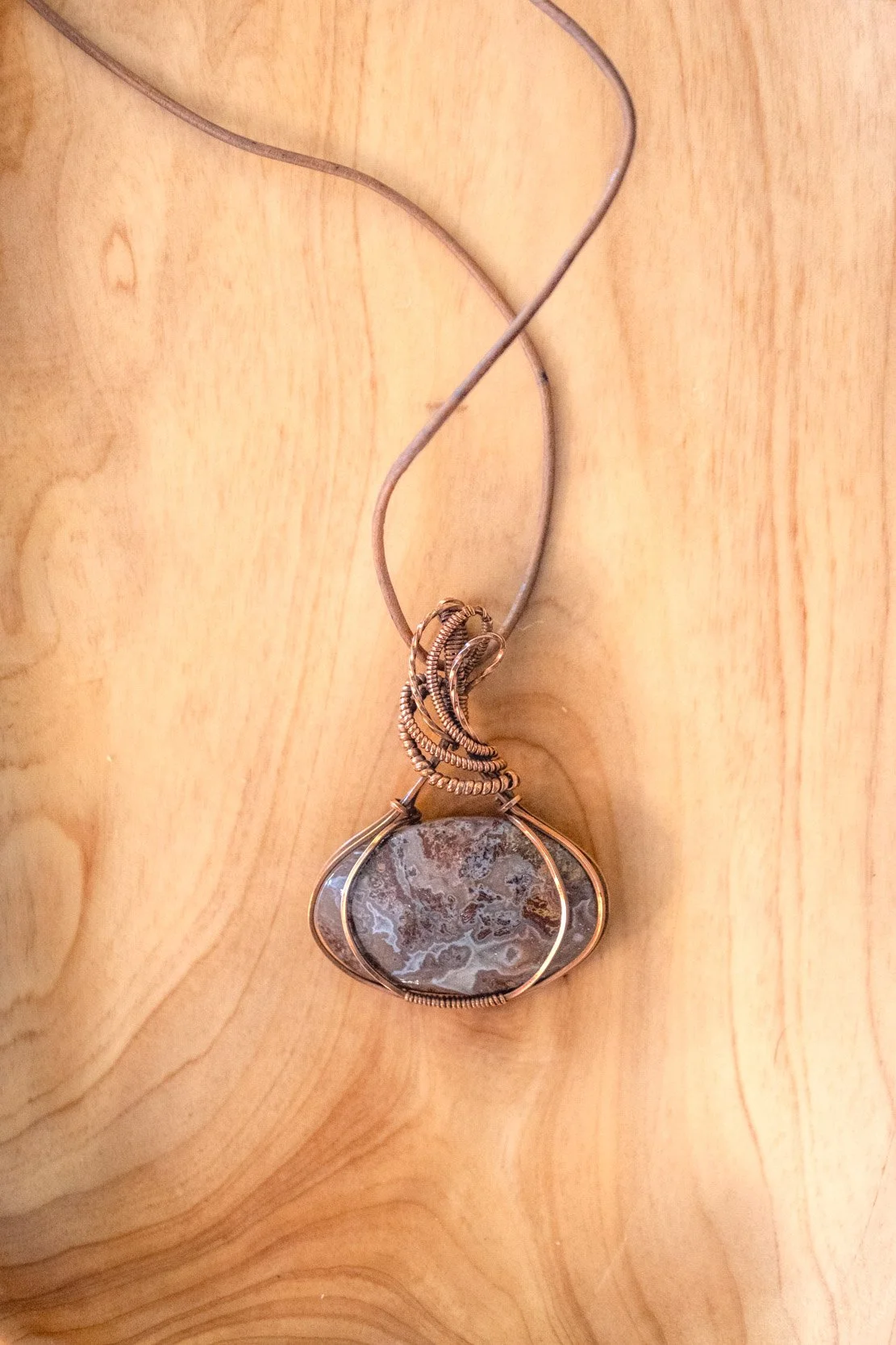 Crazy Lace Agate wrapped in raw copper & oxidized