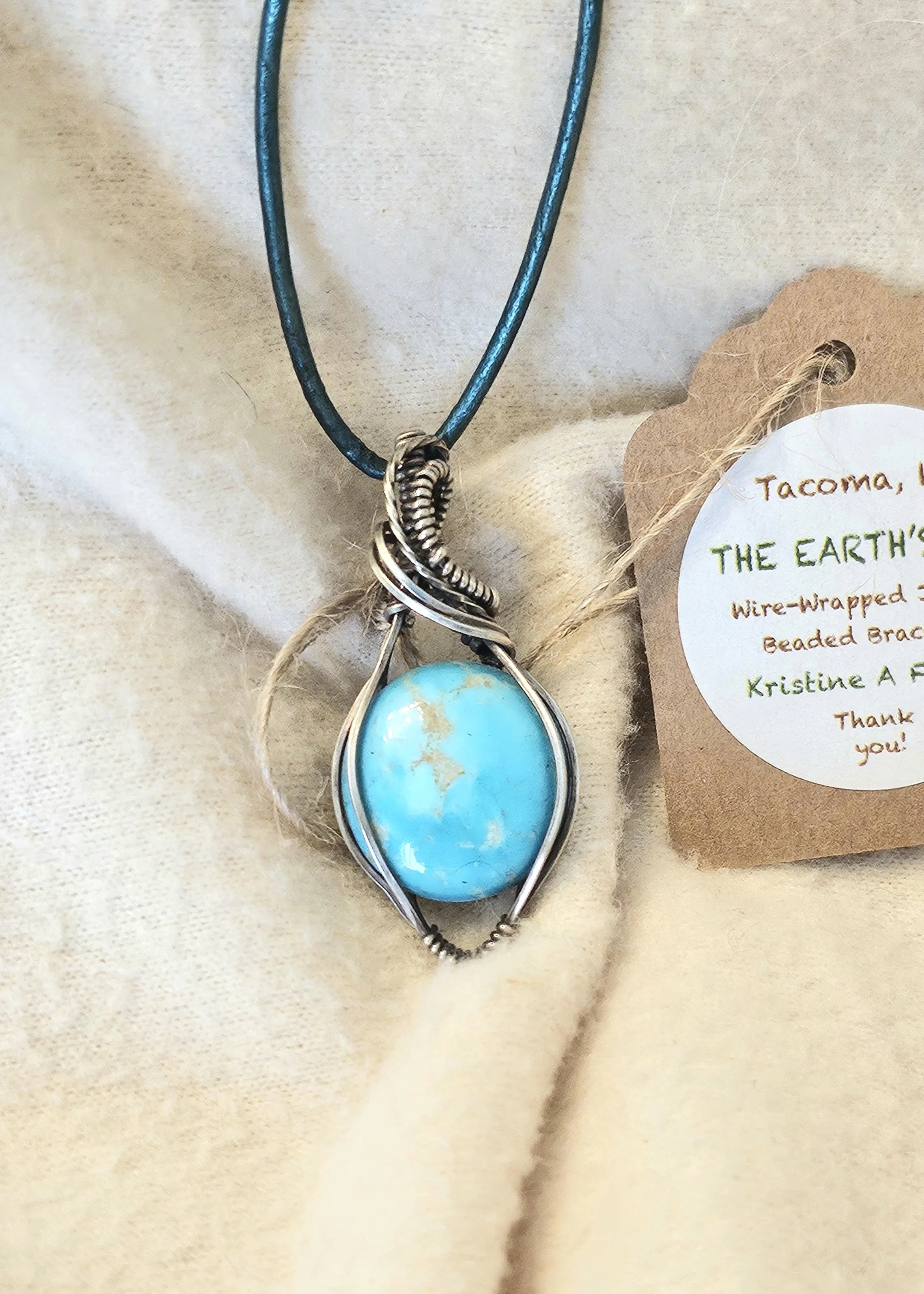 Turquoise (NFFN) wrapped in Sterling Silver