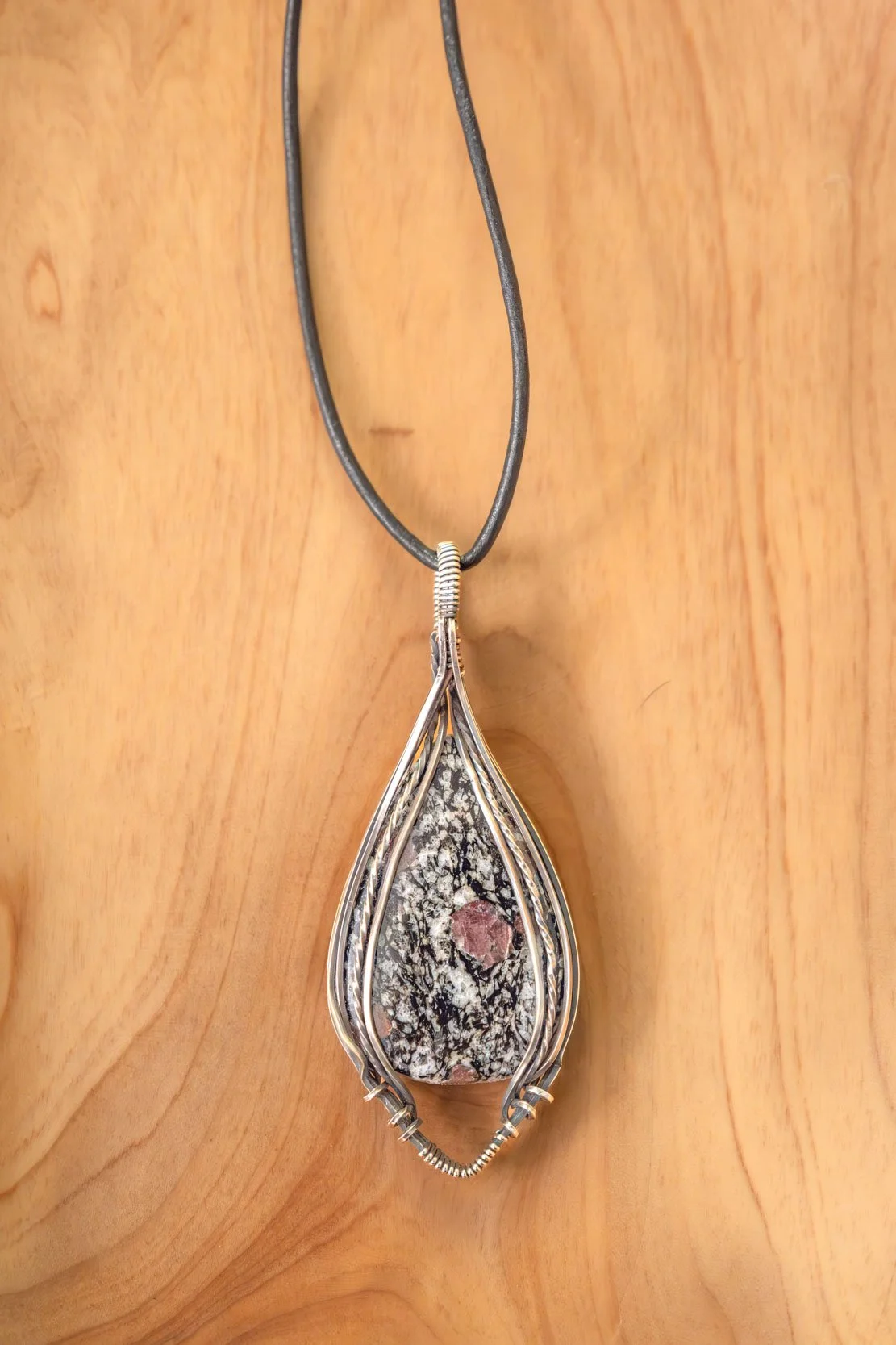 Almandine Garnet, wrapped in sterling silver & oxidized