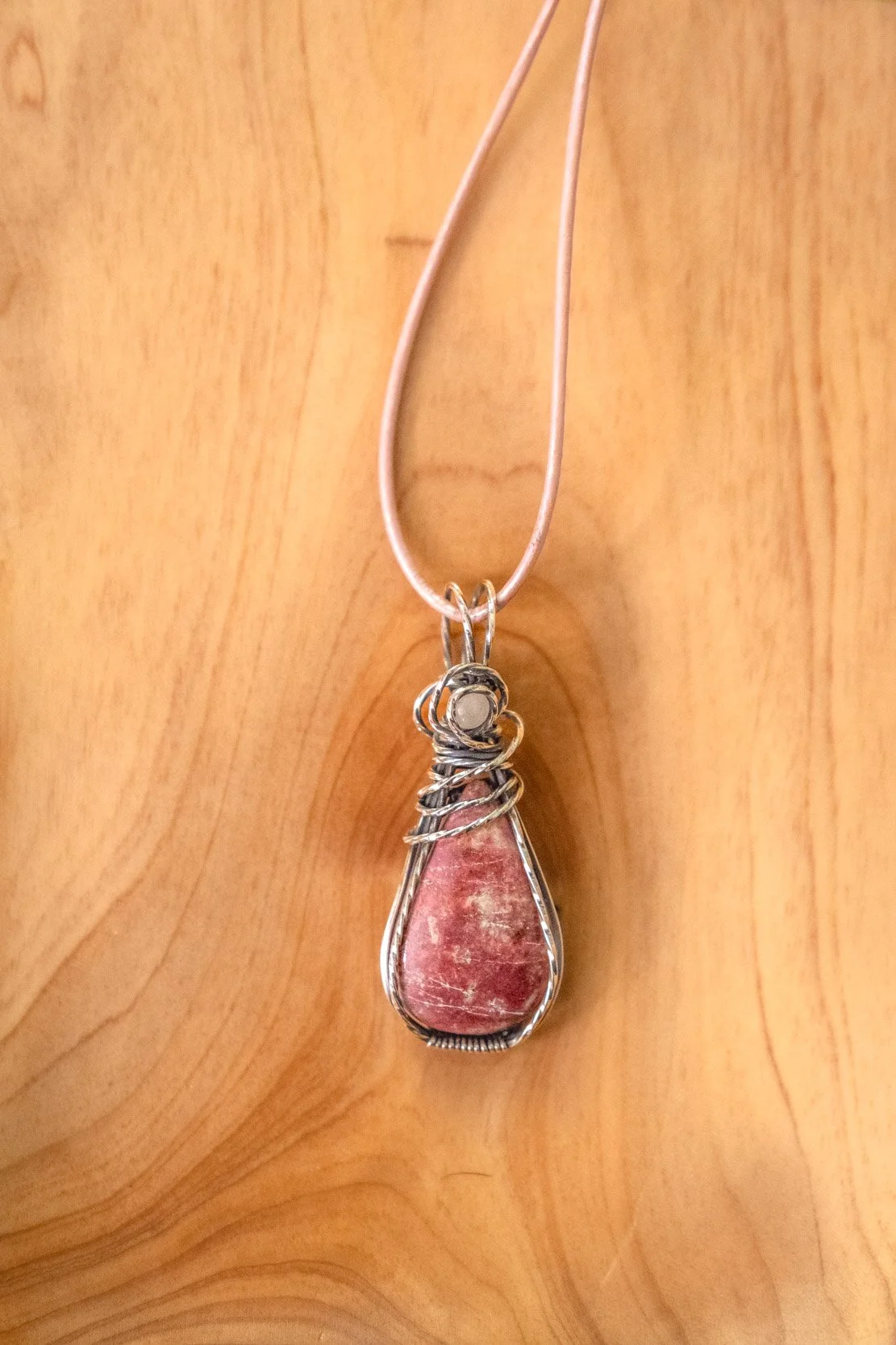 Thulite, wrapped in sterling silver & oxidized