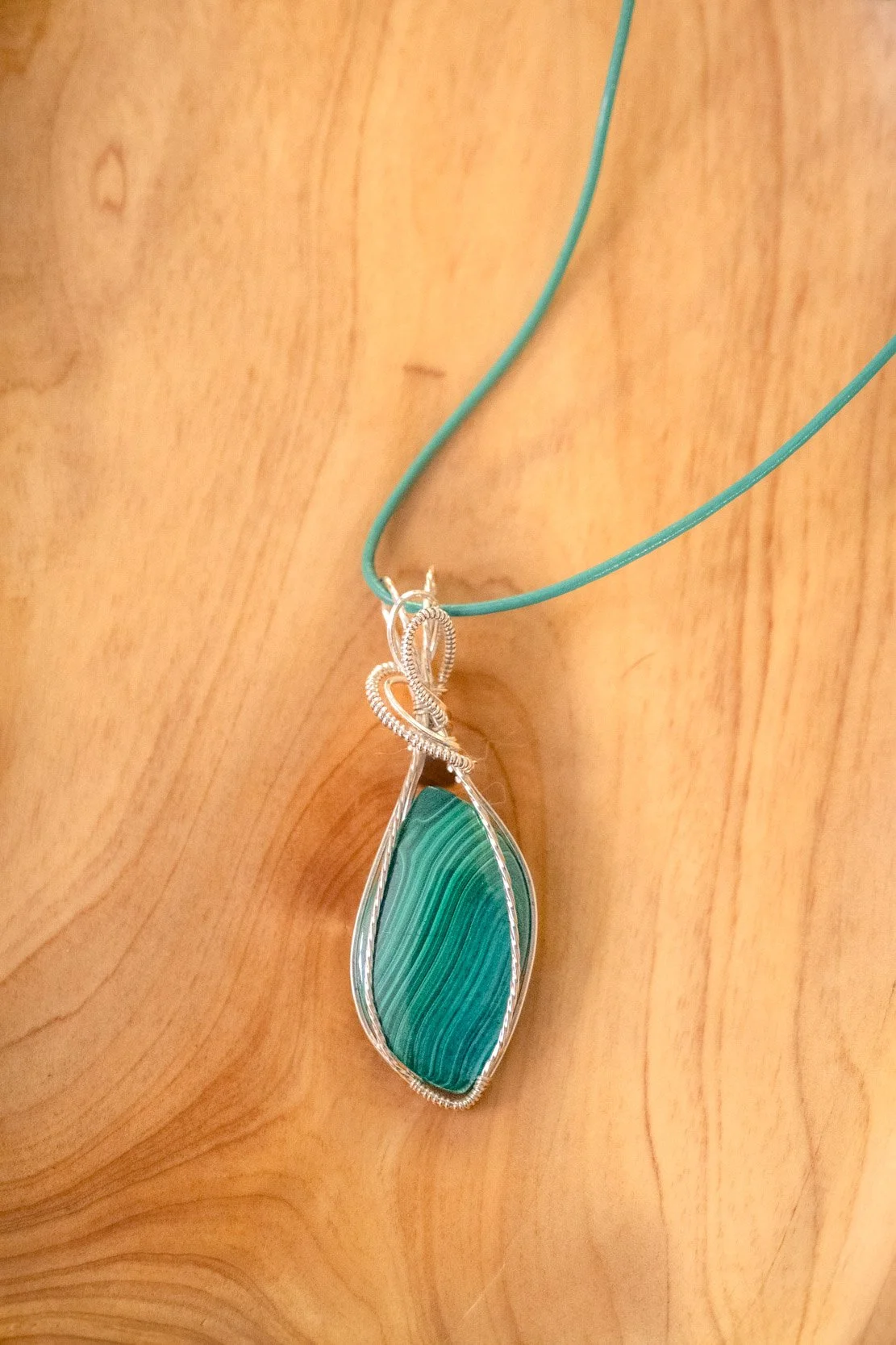 Malachite wrapped in sterling silver