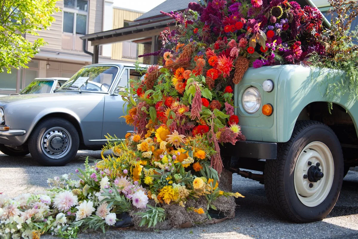 Local-only rainbow flower installation for Flowers & Fenders 2024