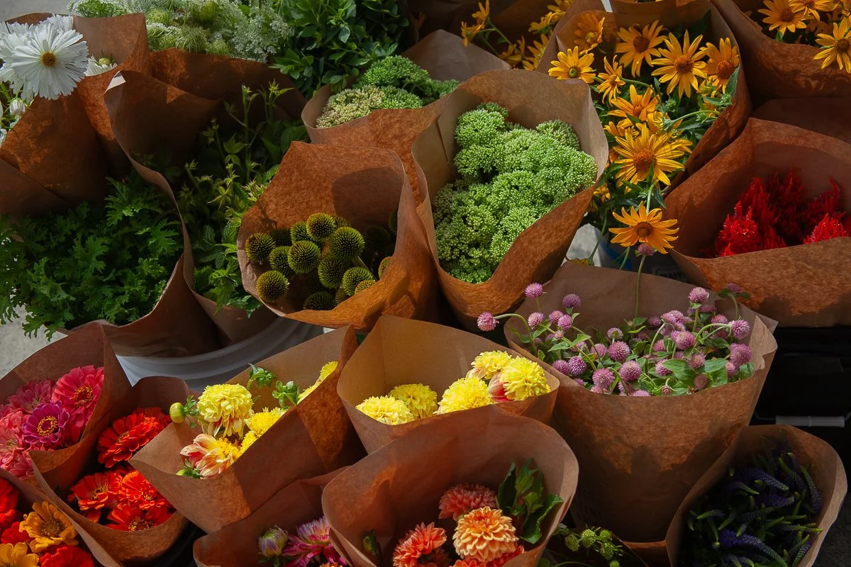 A packed van of wholesale flowers ready to be delivered.