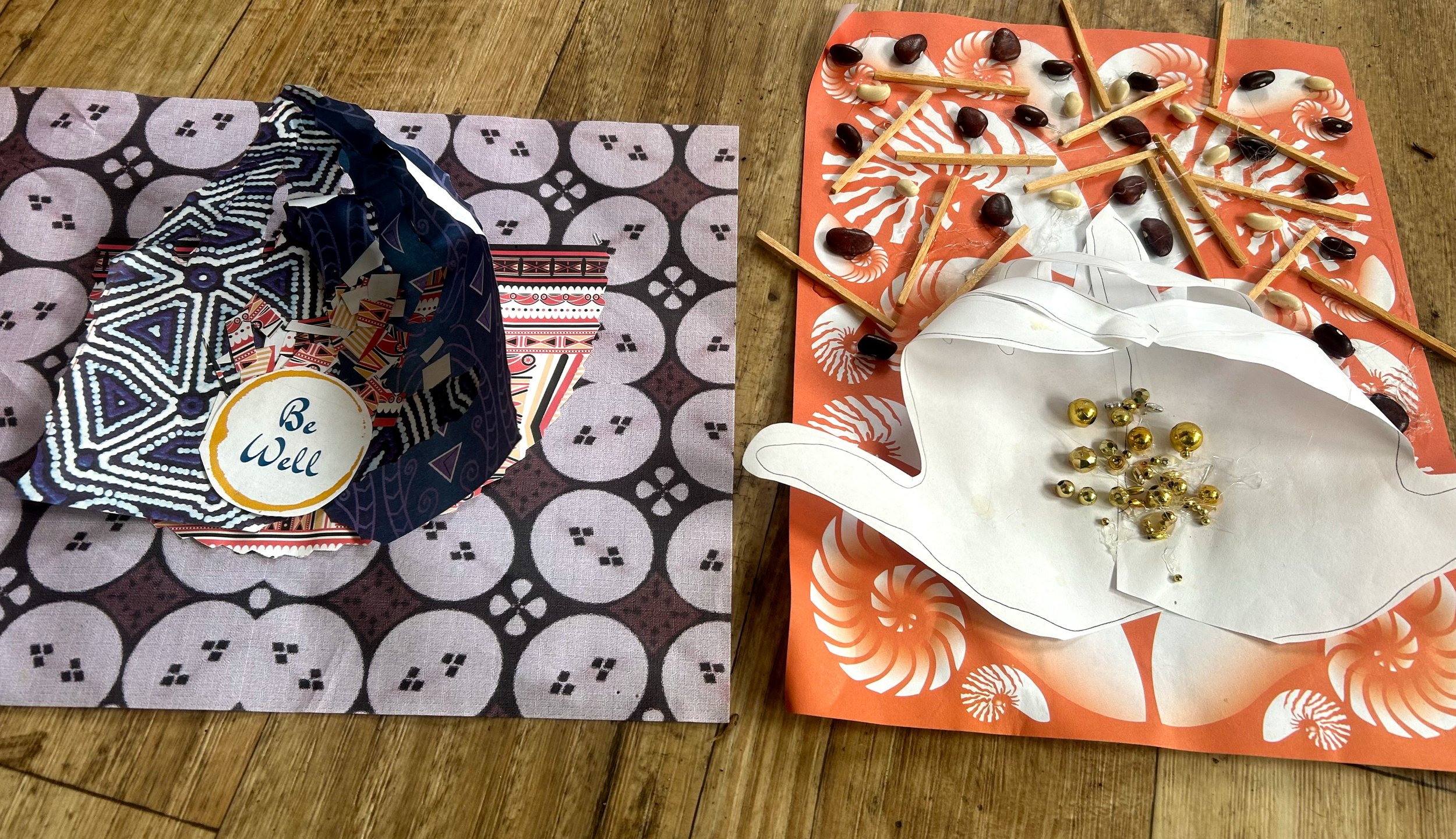 Exterior of an old house with white siding, a window with a flower box, and a weathered wooden door. There is a concrete bench in front with a wreath and potted plants, including pink and red flowers.