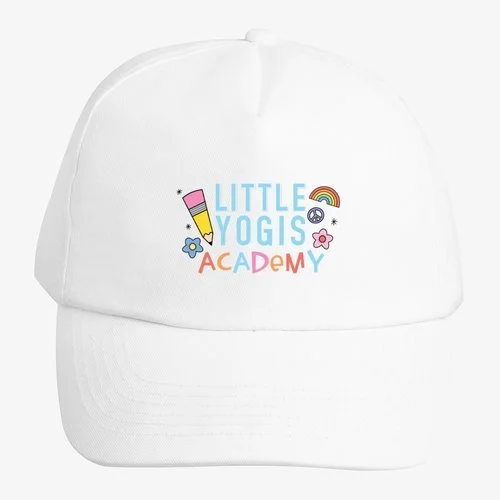 White baseball cap with colorful text and graphics that say 'Little Yogis Academy', including a pencil, rainbow, and flowers.