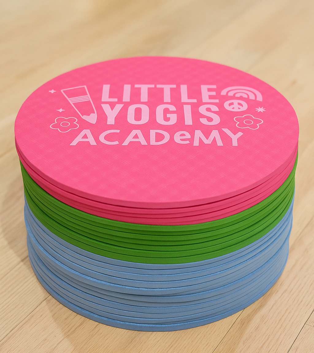 a stack of colourful kids yoga mats