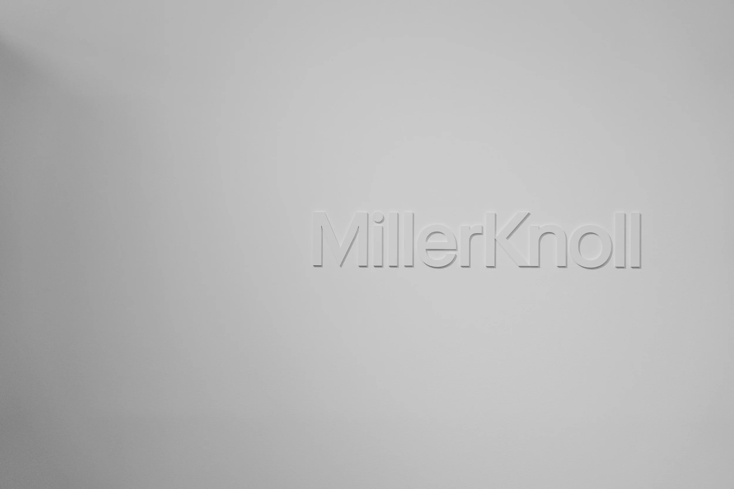 Close-up of a silver Millefiori glass paperweight with decorative floral and swirl patterns.