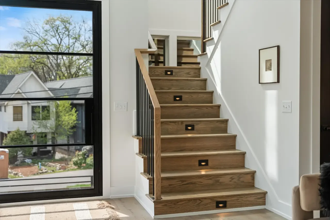 Oak stair case with iron spindles and riser lighting