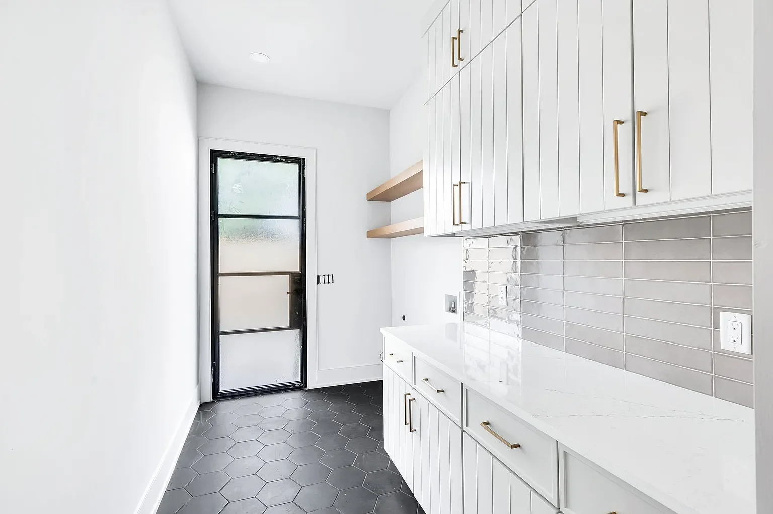 Laundry mudroom with iron back door