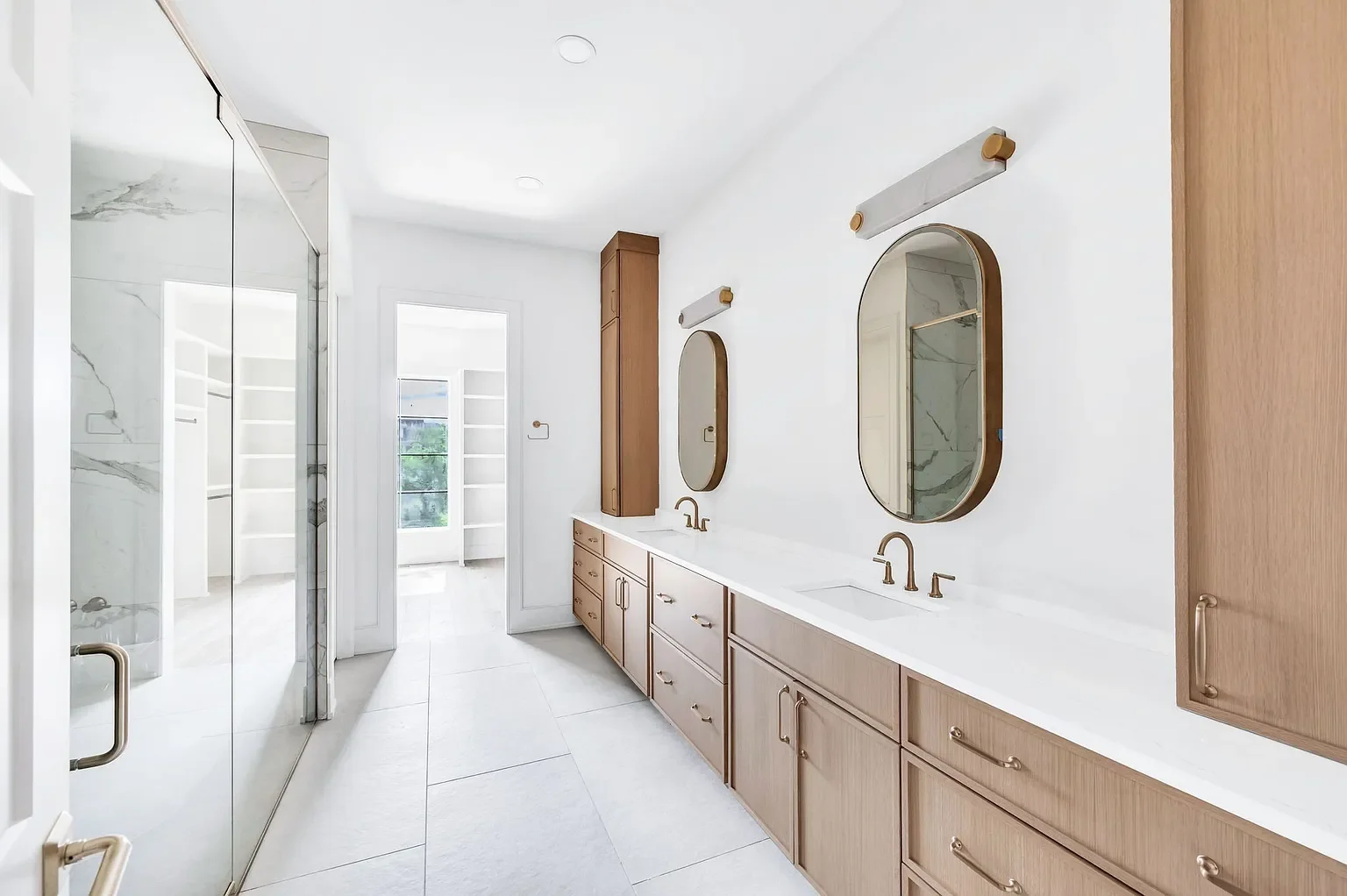 primary bath double vanity with tile floor