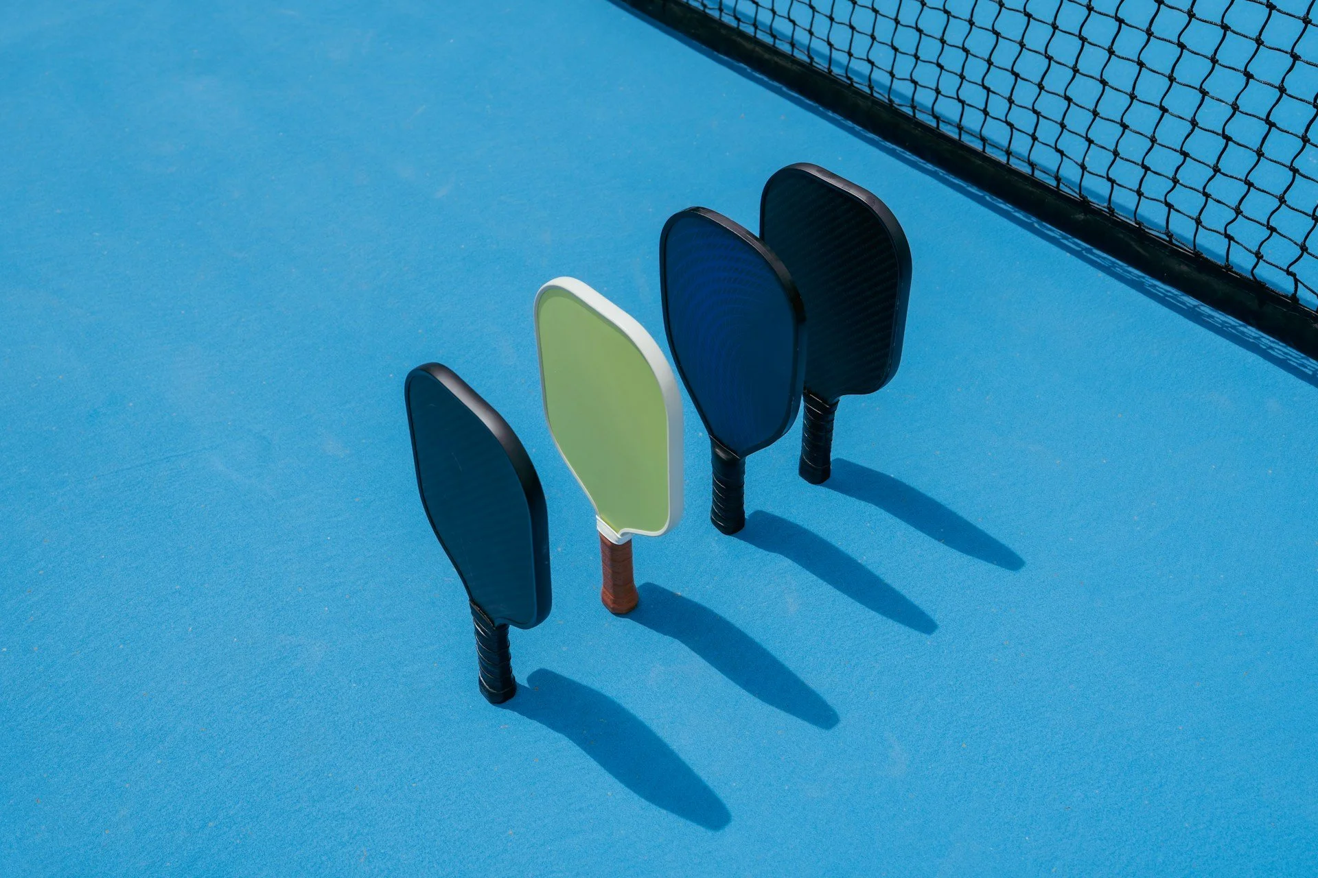 pickleball paddles on the court at baseline gvl