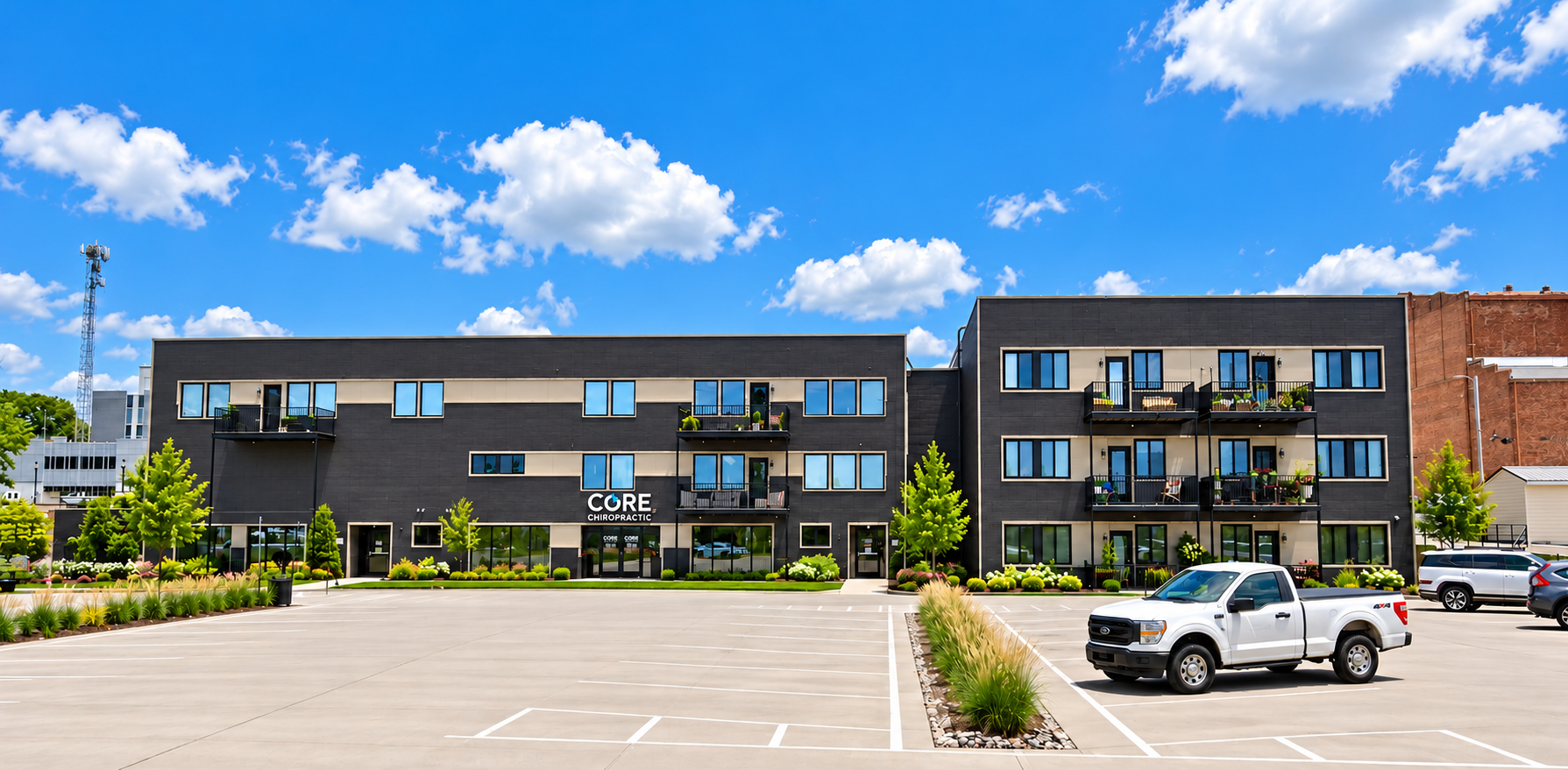 Modern Commercial Building with Landscaped Parking Lot.png