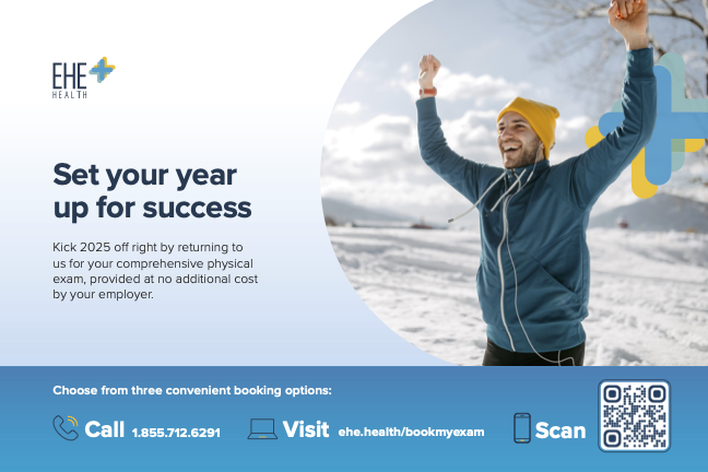 A man wearing a yellow hat and a blue jacket celebrating outdoors in a snowy landscape, with his arms raised.