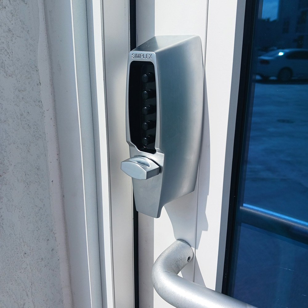 Commercial storefront door with a keypad lock installed by Lockspert.