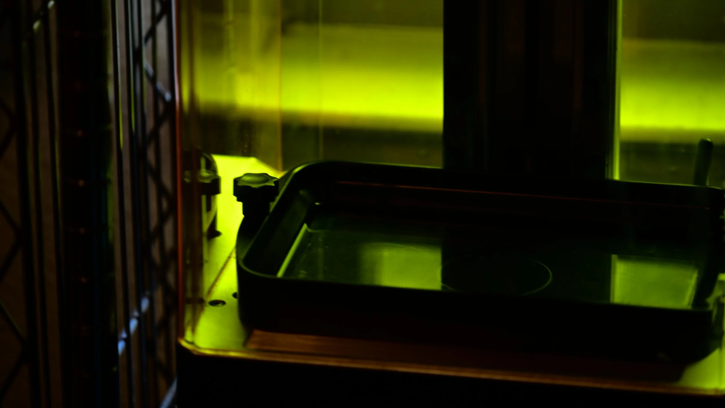 Geometric drawing of an outline square with sections divided by vertical, horizontal, and half circle lines.