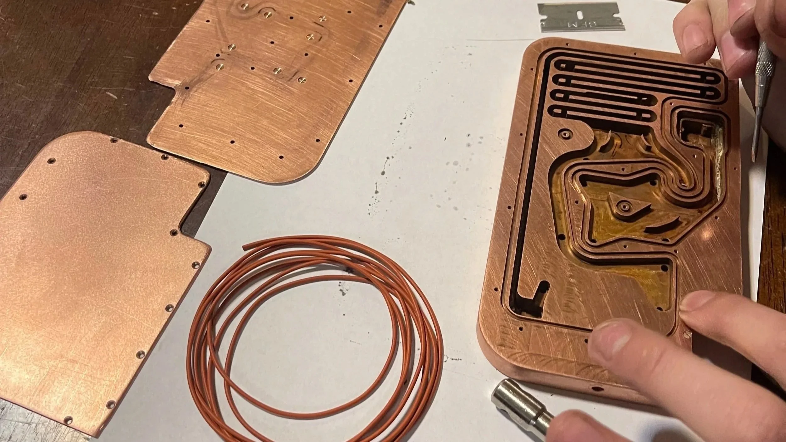 image of inspecting and placing gasket on a cnc milled part