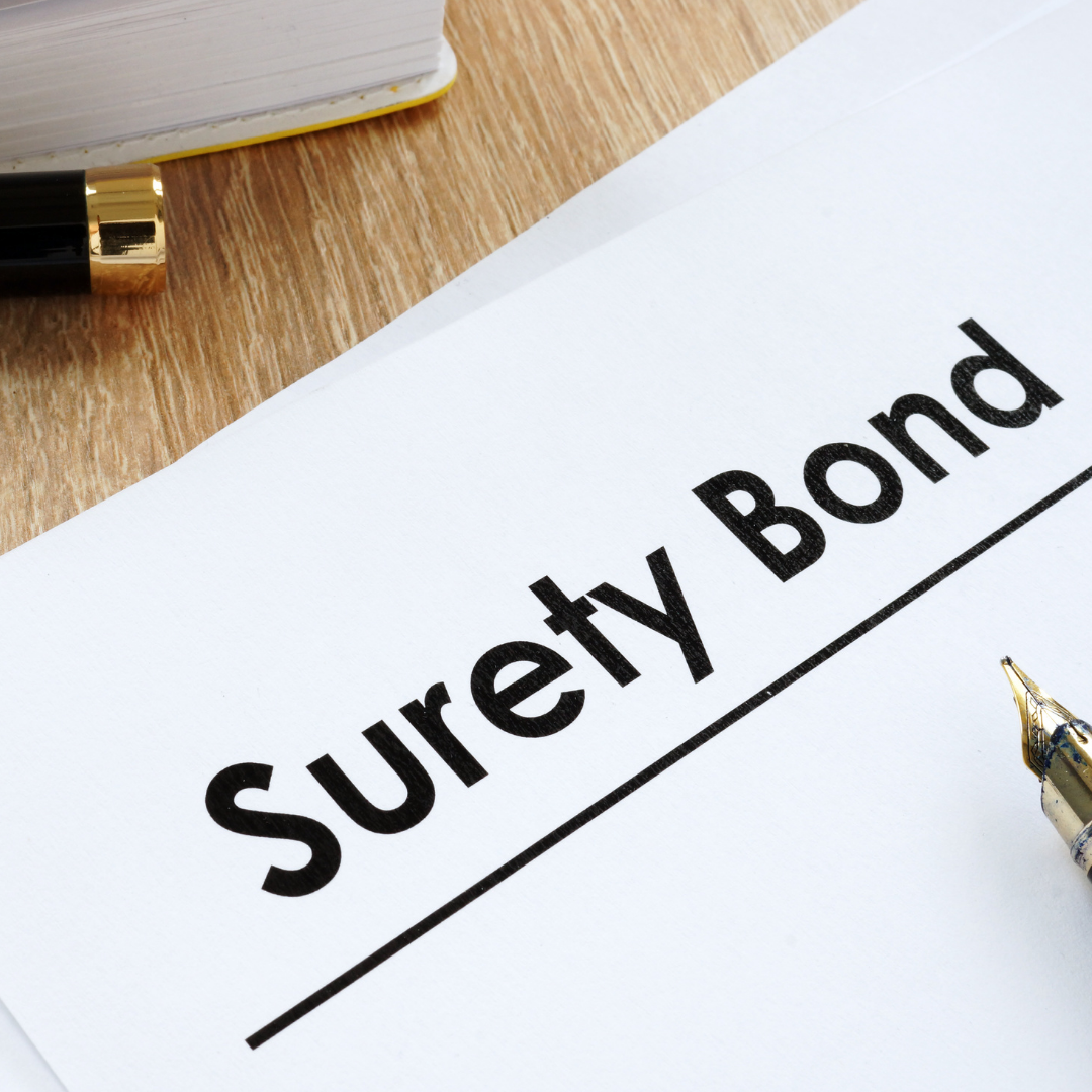 Close-up of a document titled 'Survey Bond' on a wooden desk, with a black and gold pen, a yellow and white notebook, and a piece of paper.