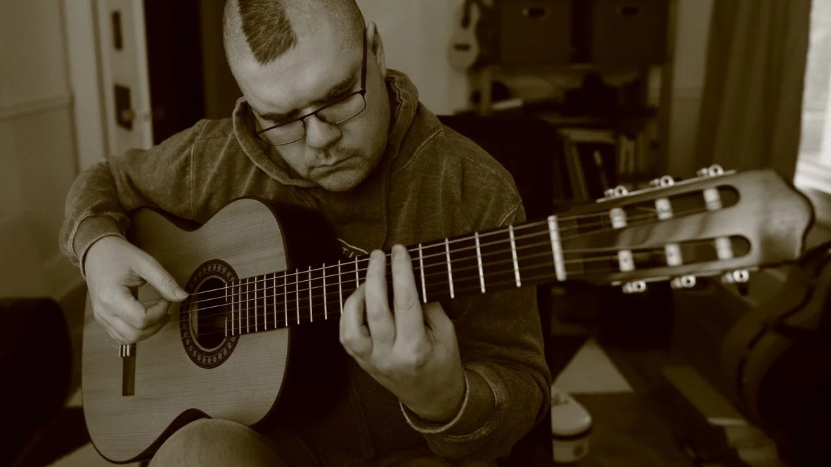 William playing guitar