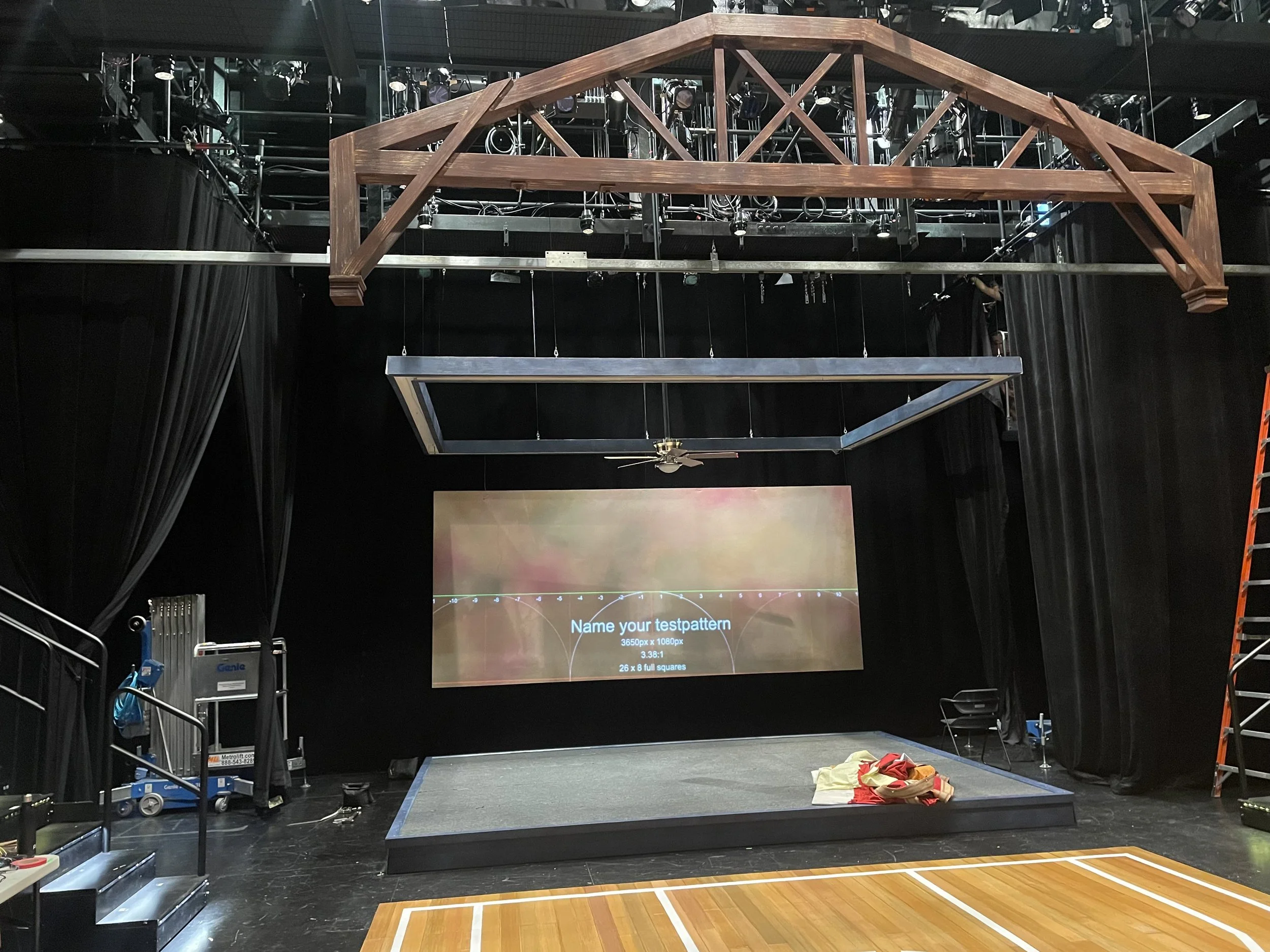 Facing North with projection screen, halo, stage, and one rafter