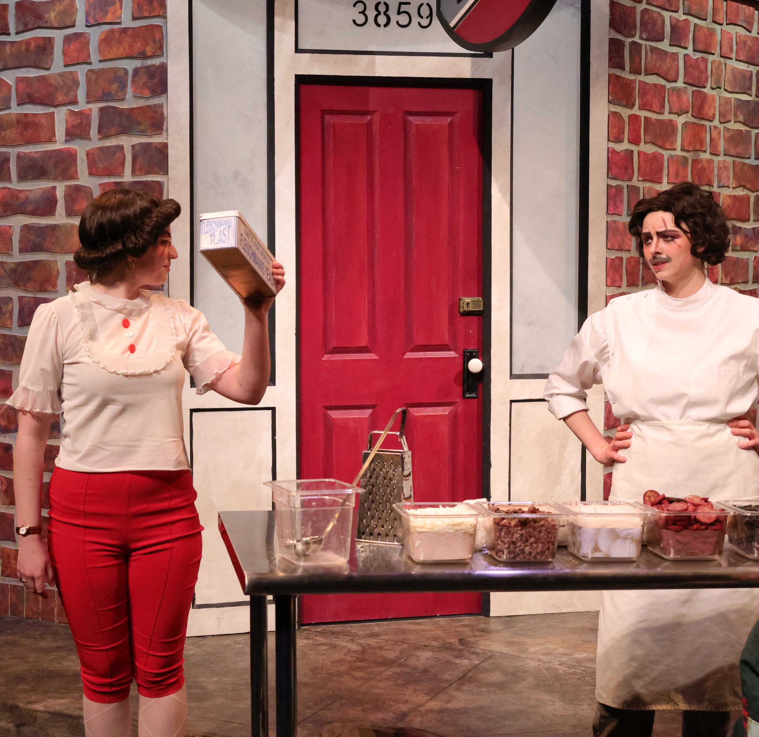 Esme holds up a tin of yeast, Tricia Disapproves