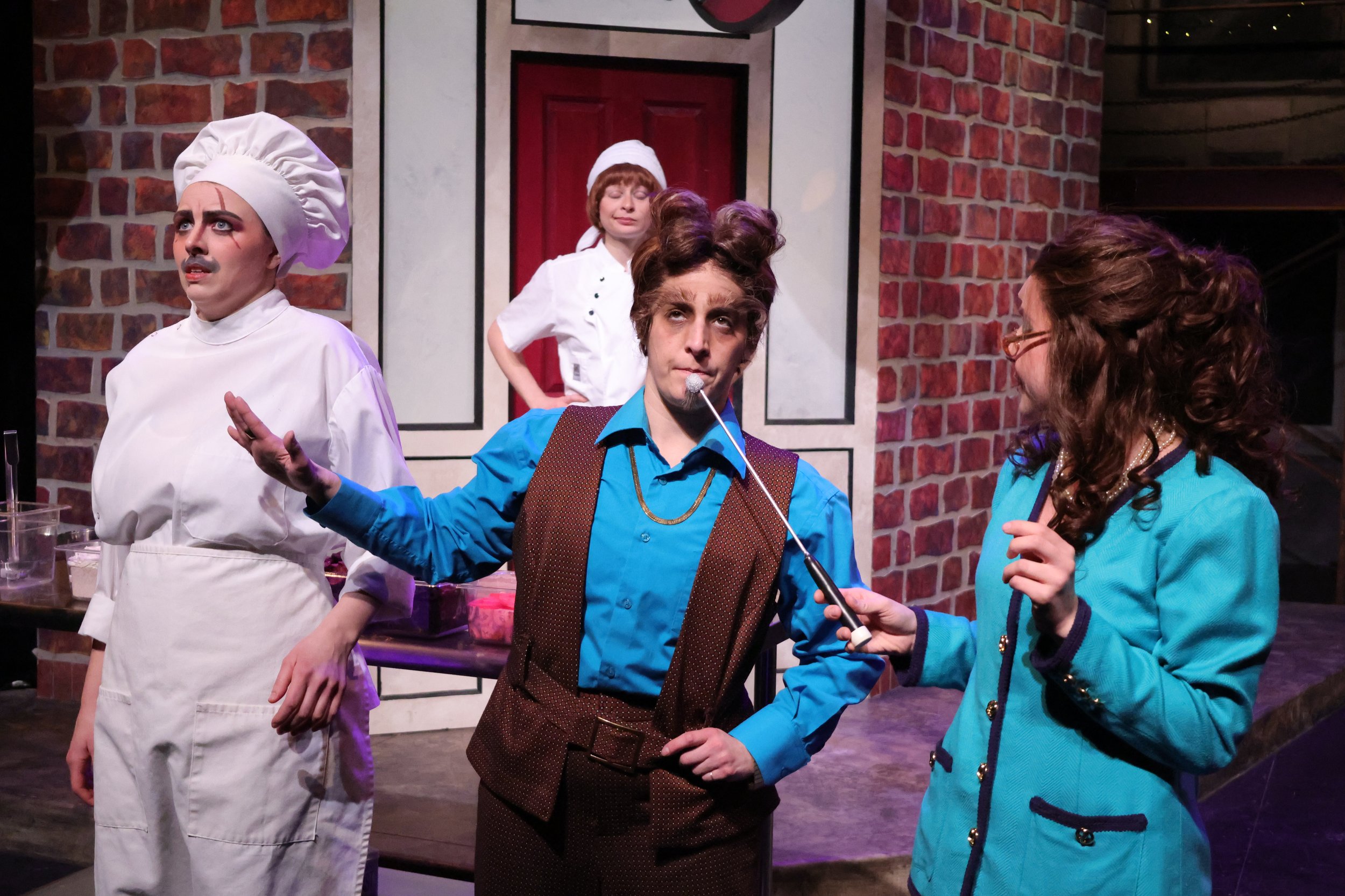 A reporter interviews Lou with a game-show microphone