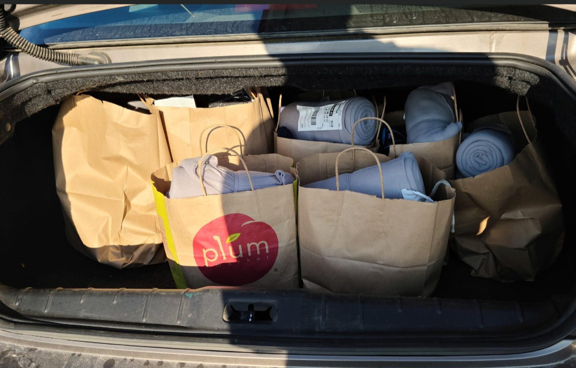 Car trunk filled with donations from Gobble Gobble Give Detroit hosted by It’s Giving Detroit by Emily Stocker