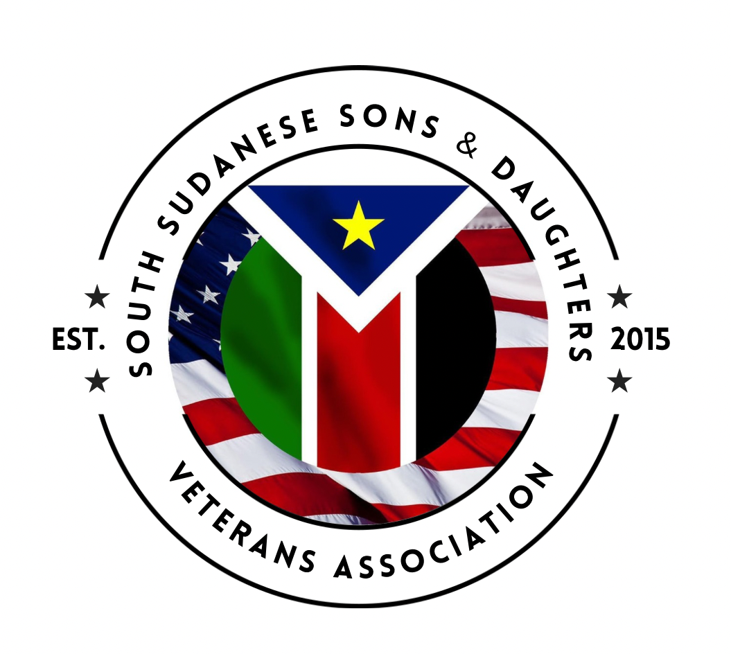A circular logo for the South Sudanese Sons & Daughters Veterans Association featuring the South Sudan flag, surrounded by an American flag background with text indicating the organization's name, establishment year 2015, and their focus on veterans.