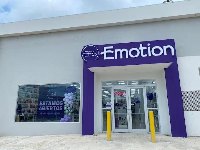 EBS Emotion store entrance with a purple and white exterior, glass doors, and a sign indicating it's open, located in a commercial area.