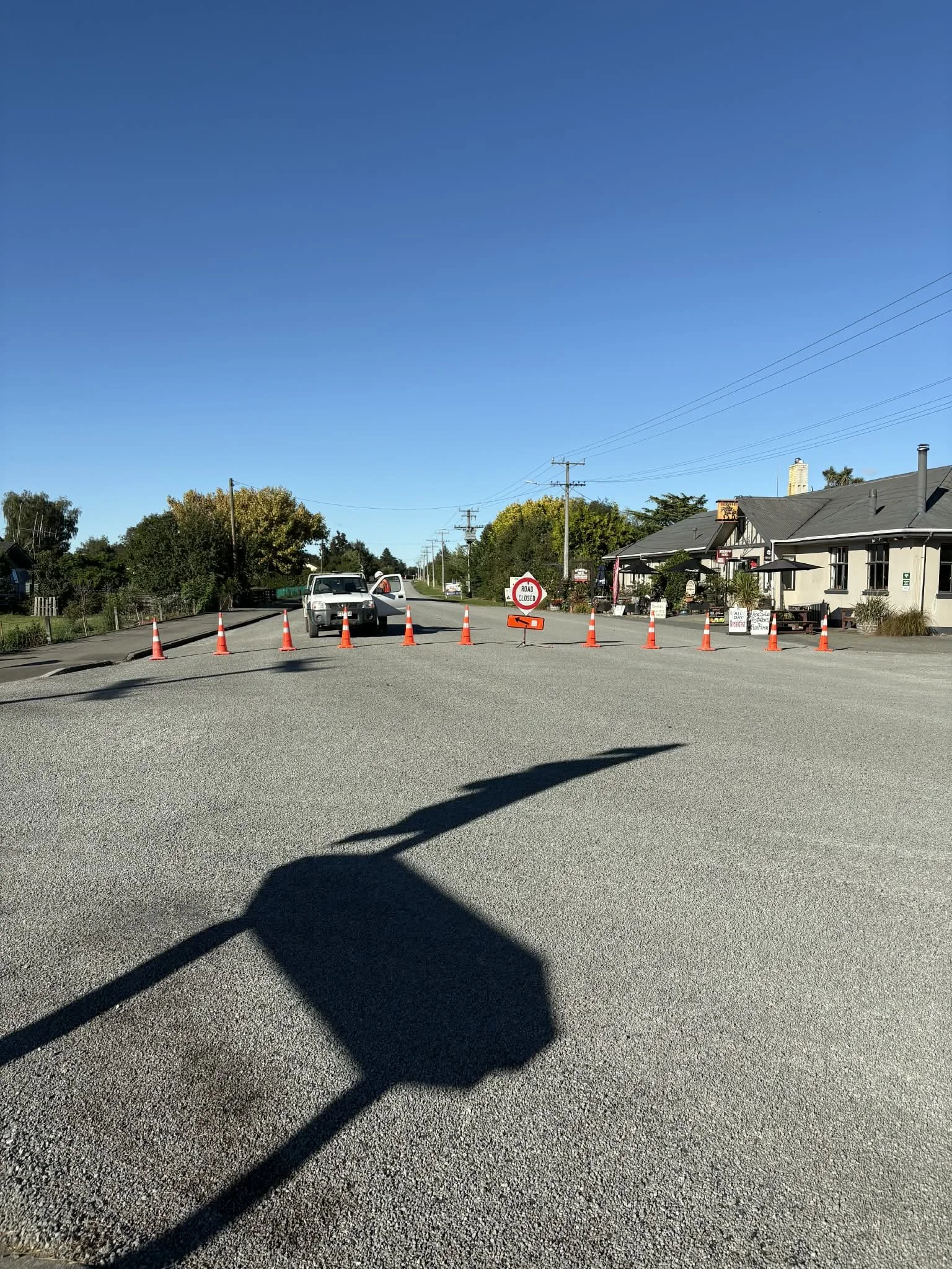 gravel, cones, building, signs, trucks, road closed, traffic, no entry