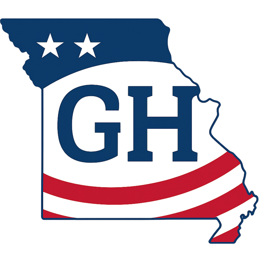 Outline of the state of Missouri filled with an American flag pattern and the letters 'G H' in the center, with two white stars above.