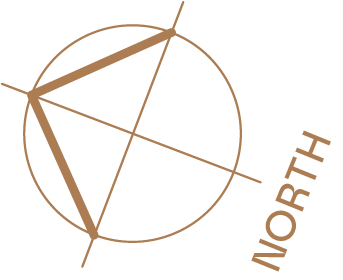A compass with the word "NORTH" on the right side and a stylized geometric design inside a circle.