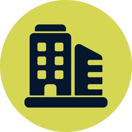 Icon of a hotel building with a separate structure next to it, within a green circular background.