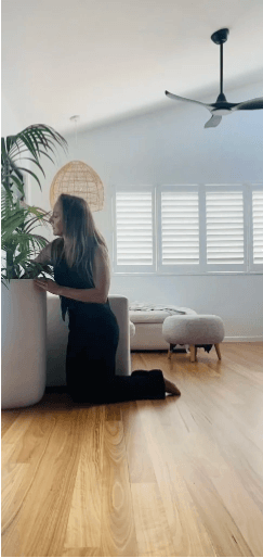Founder Jane styling plants in beach house sunshine coast