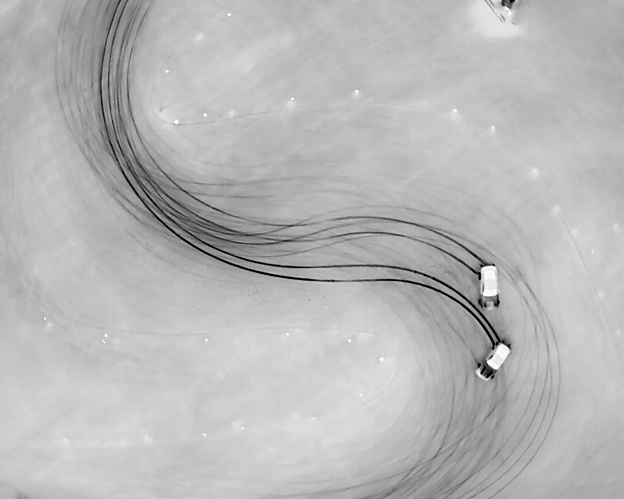 An infrared photo of drifting cars at nola motorsports. The heat from the tires can be seen on the thermal camera and the result is each driver creating infrared brushstrokes with each line they take.
