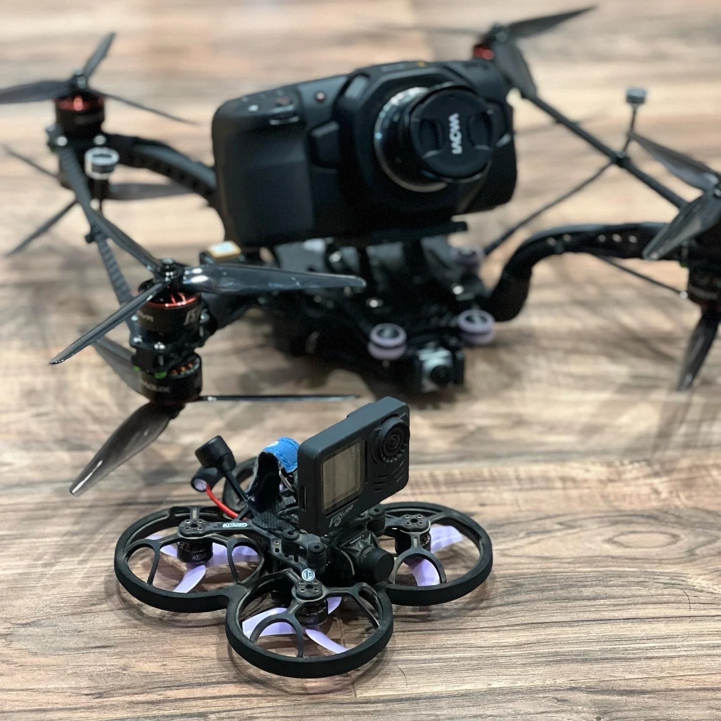 Sub250gram custom FPV Drone with a naked gopro and a custom X8 cinelifter FPV drone with a Black Magic Pocket Cinema Camera
