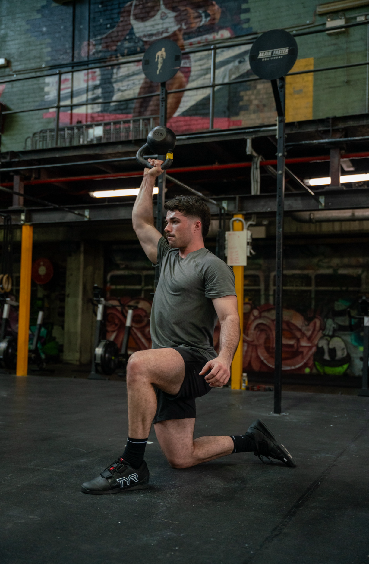 Sports Chiropractor Doing Shoulder Rehab in a Gym