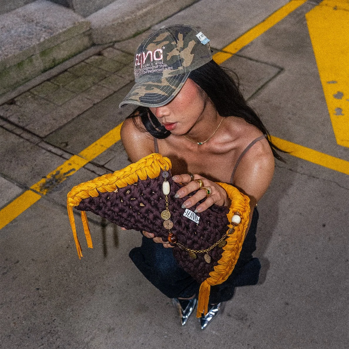 The limited JUNO Rumblehoney bag in deep brown with a vibrant honey coloured handle