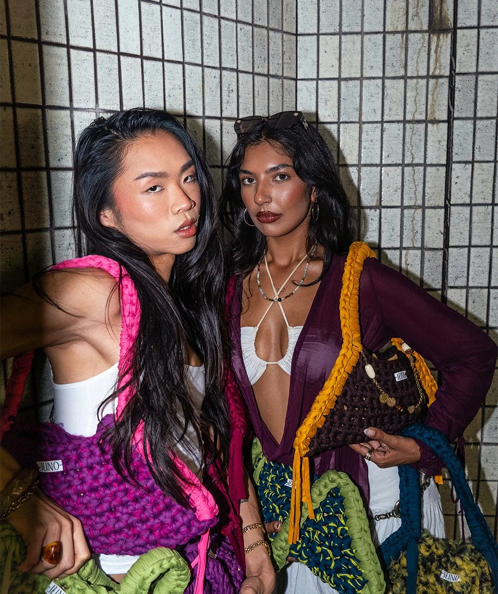 Two Models Holding Juno Crochet Bags in an Australian Cityscape.
