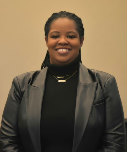 Abstract pattern with black semi-circles and quarter-circles on a cream background.