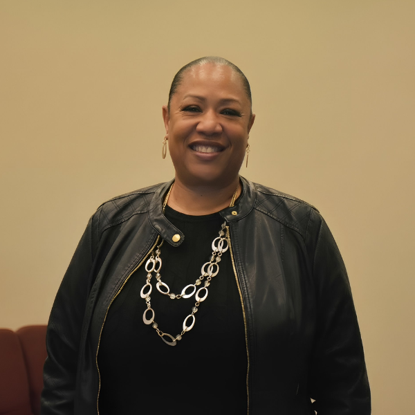 Abstract pattern of black semicircles and quarter circles on a beige background.