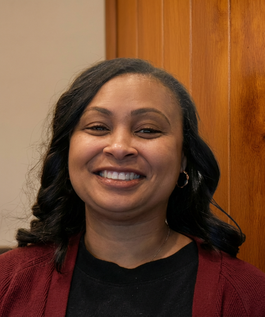 Abstract pattern with black semi-circles and quarter circles on a beige background.