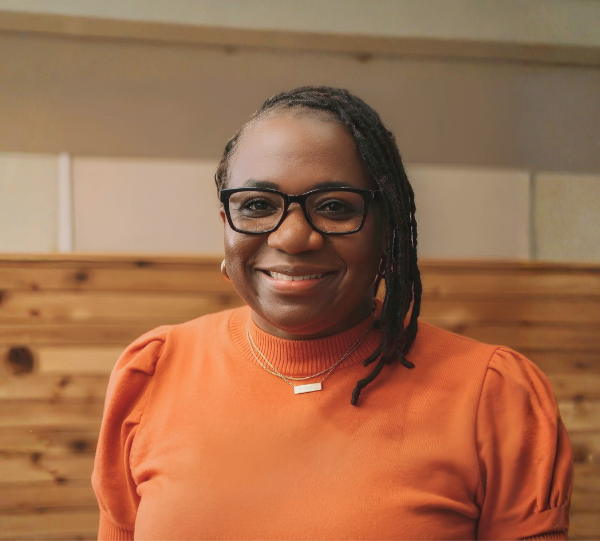 Pattern of black semi-circles and quarter-circles arranged on a beige background.
