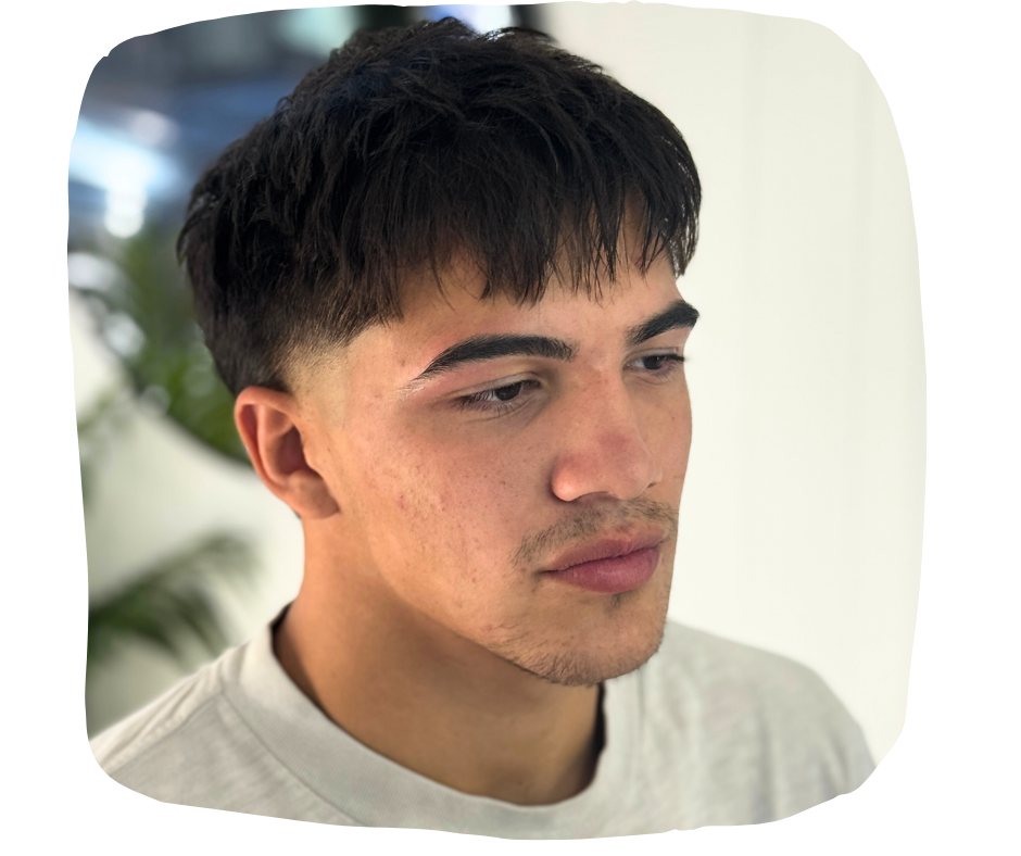 An after results photo of a young man with freshly waxed brows.