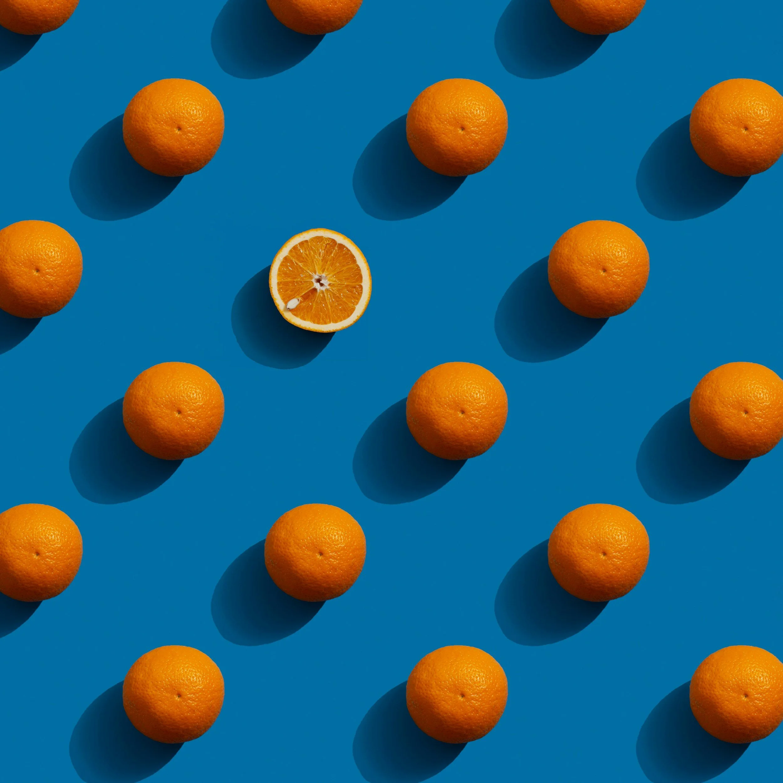 Close-up of colorful wooden nesting blocks with numbers printed on their sides, arranged in a playful manner that looks like they have been recently used.