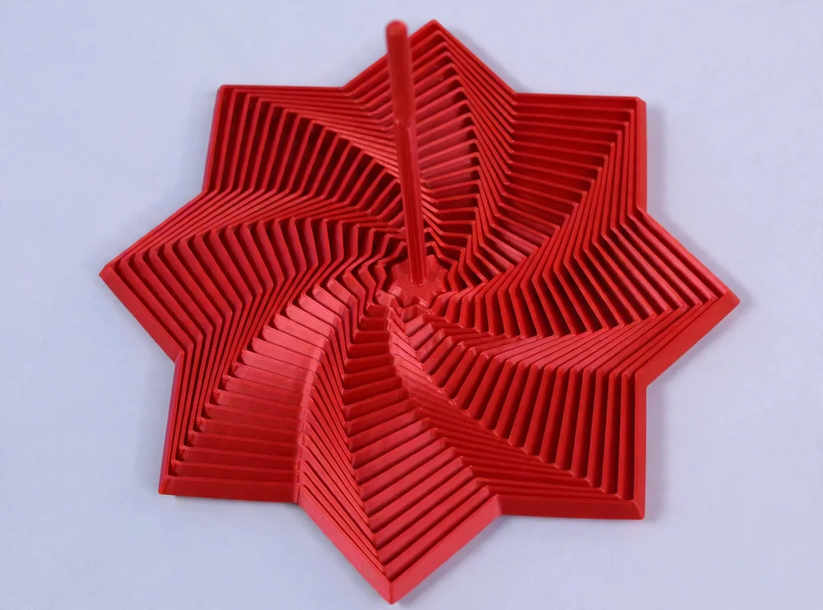 media-generation-spiral-spinner-red-0-471a670f-e01c-4825-86bd-9fe3185b1c69.webp