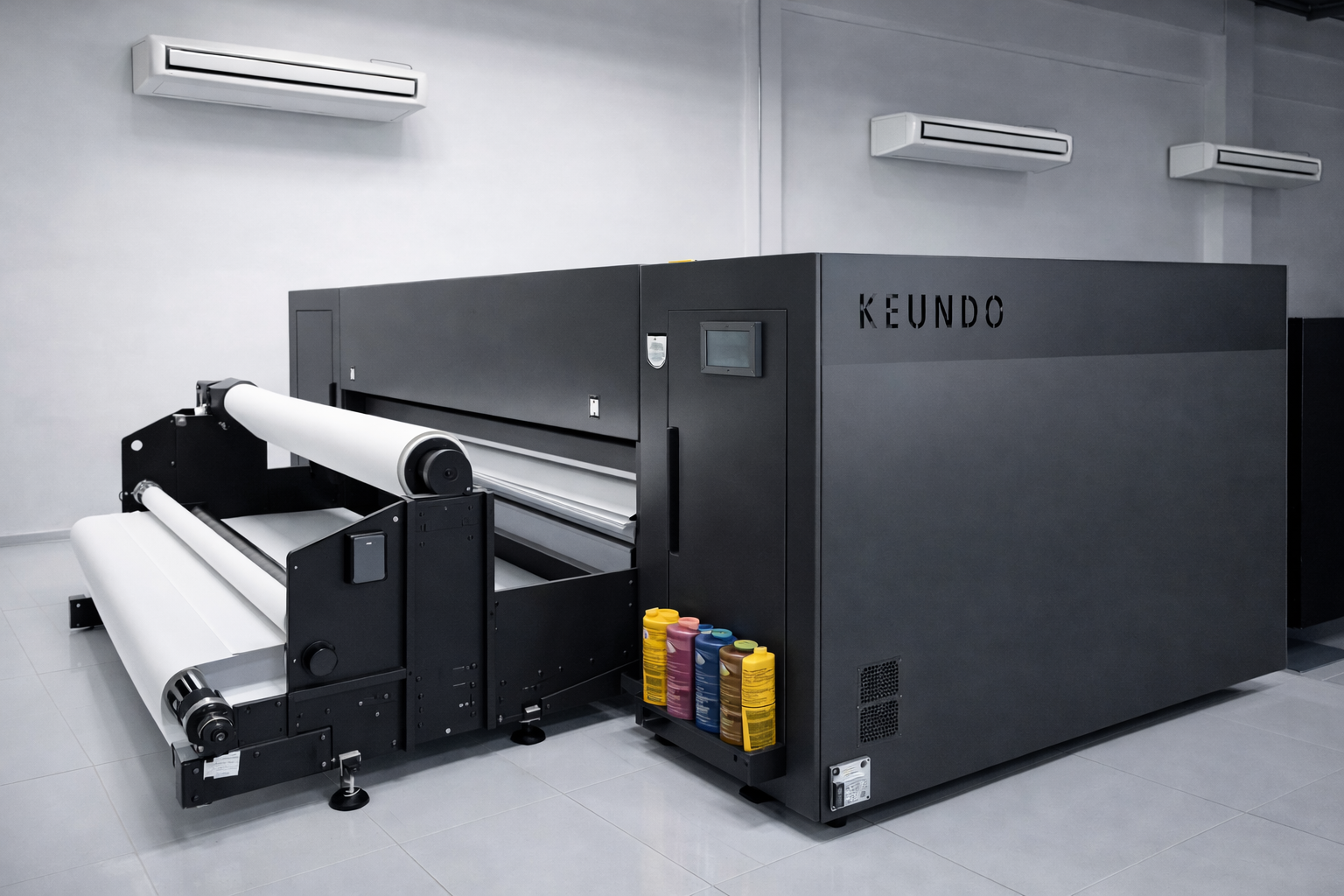Industrial sublimation printer used for high-quality fabric printing in an in-house garment manufacturing facility.