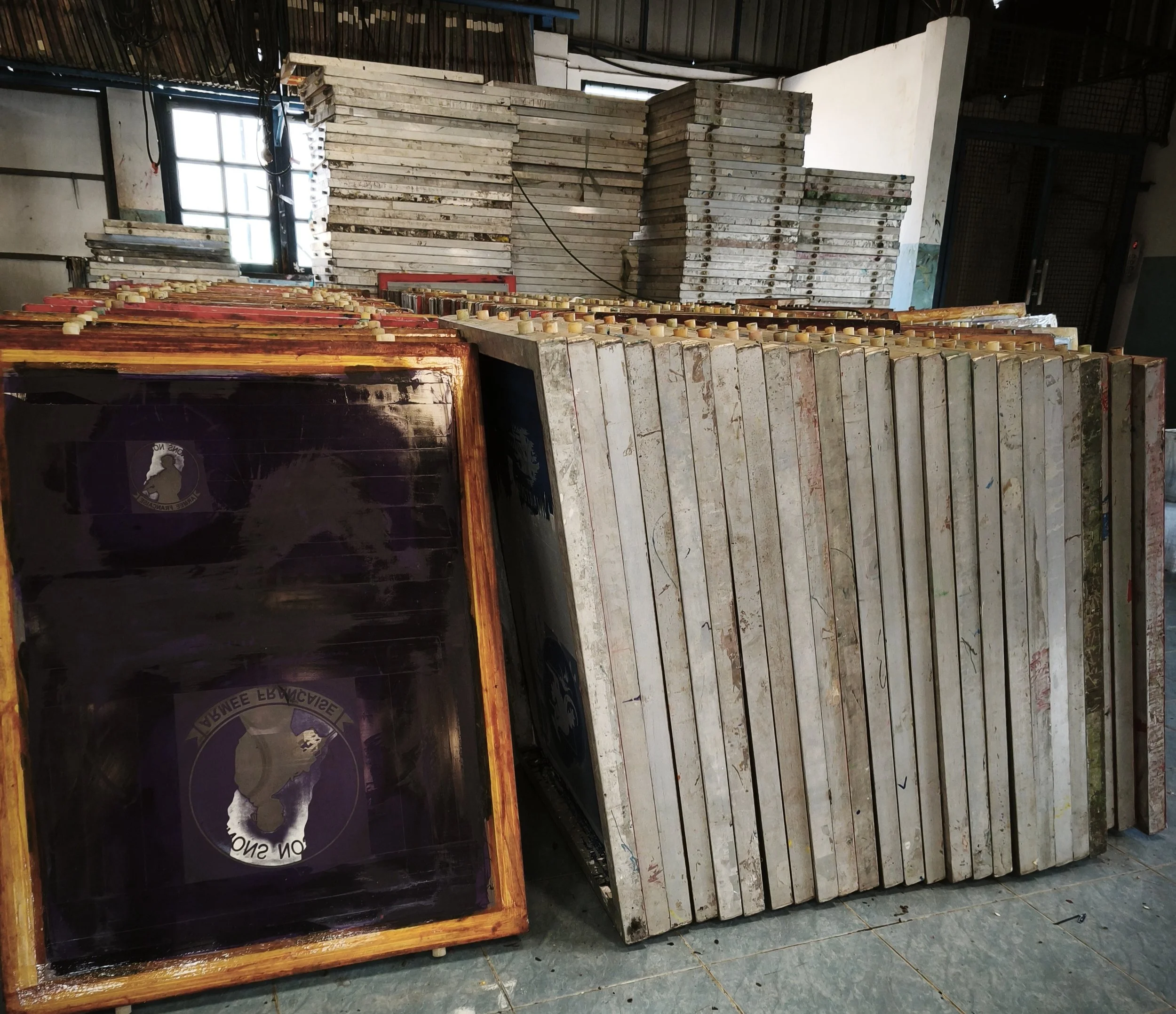 Rubber screen printing templates prepared for garment production in a Thailand manufacturing factory